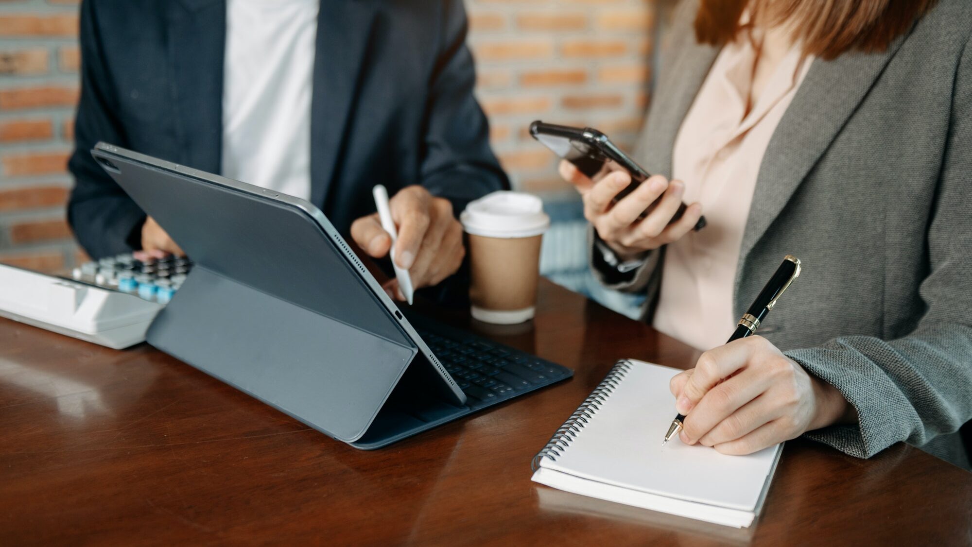 Business people meeting at office writing notes about sticky notes Laptop,tablet